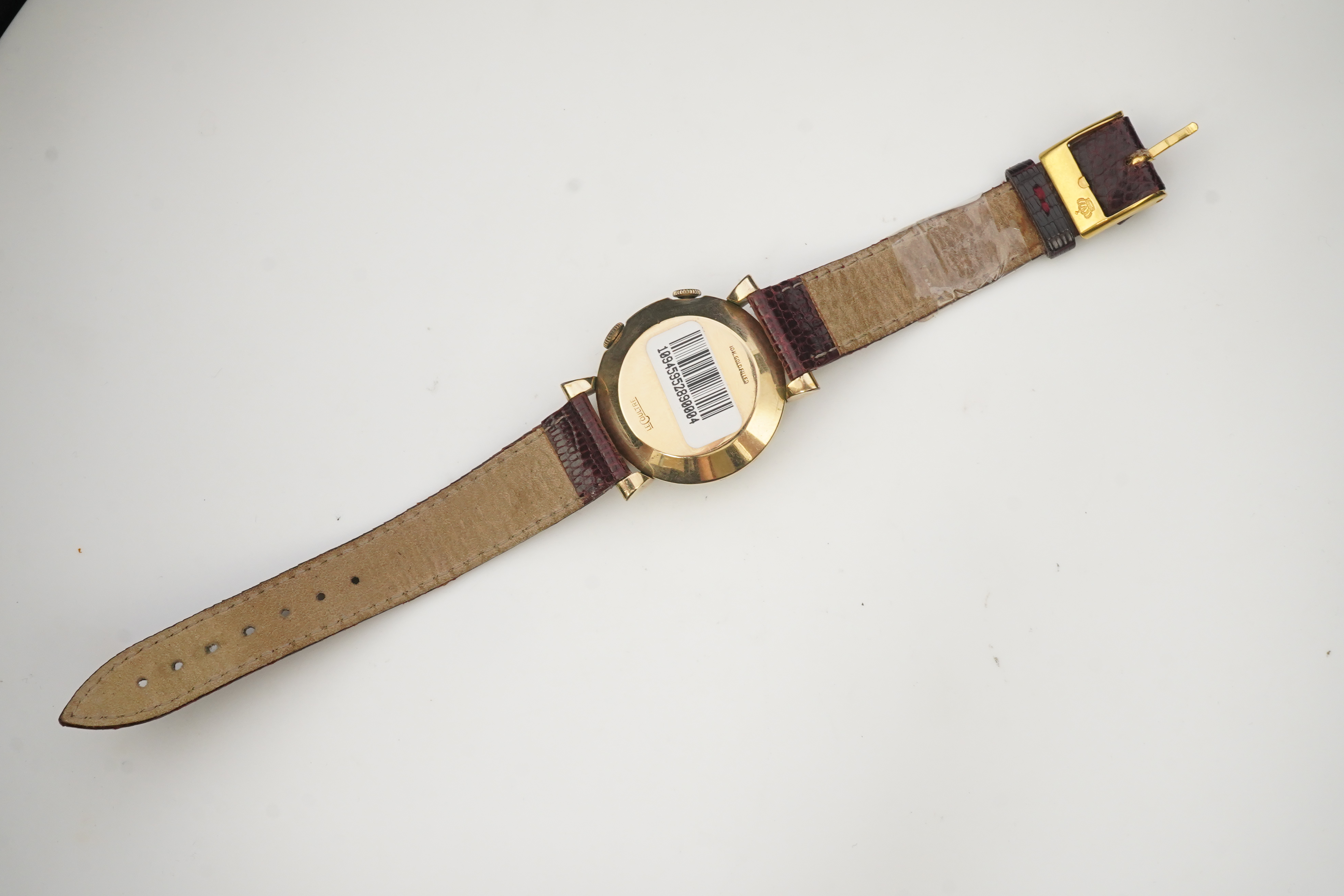 A gentleman's 1950's? 10k gold filled Jaeger LeCoultre Memovox manual wind wrist watch, on a later associated leather strap